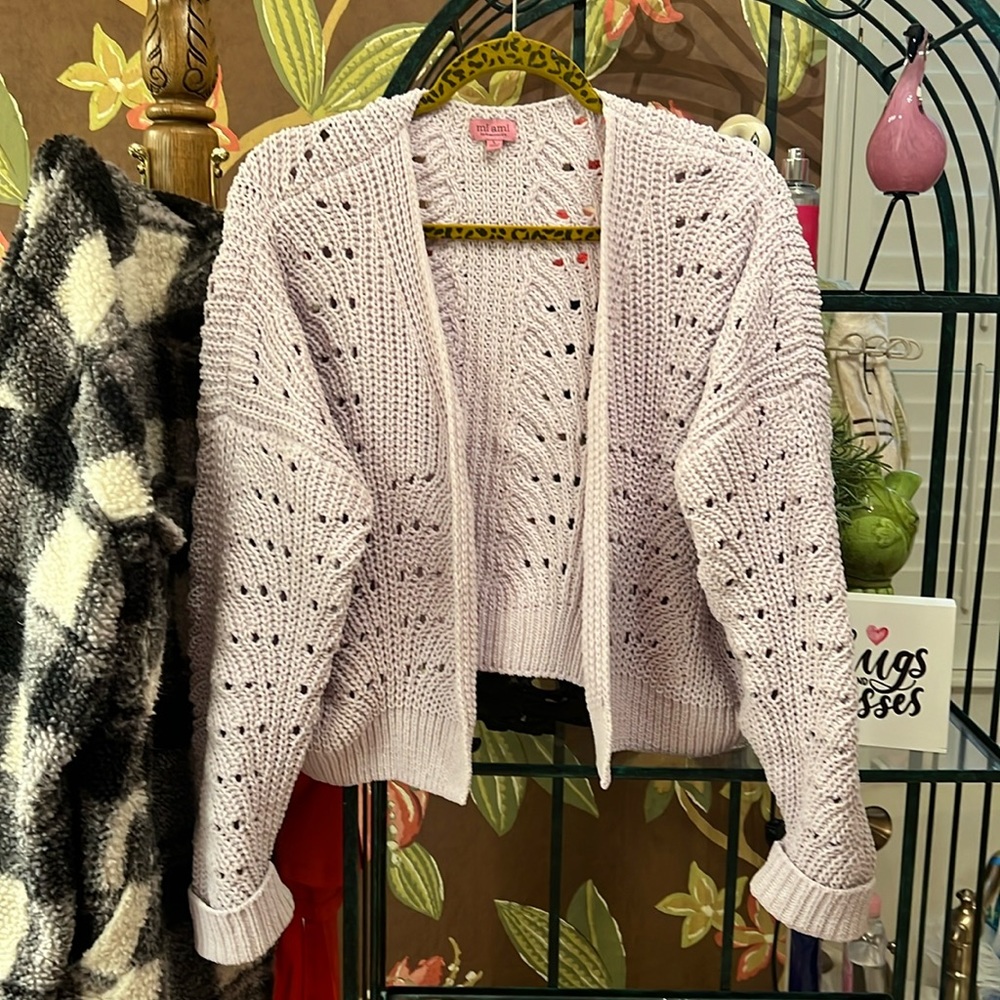Beautiful lavender cropped sweater cardigan. This is from Francesca’s.